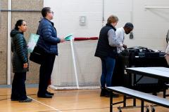 People wait to insert their ballots in a tabulation machine in Detroit, Michigan, on March 10, 2020. (Photo by JEFF KOWALSKY/AFP via Getty Images)