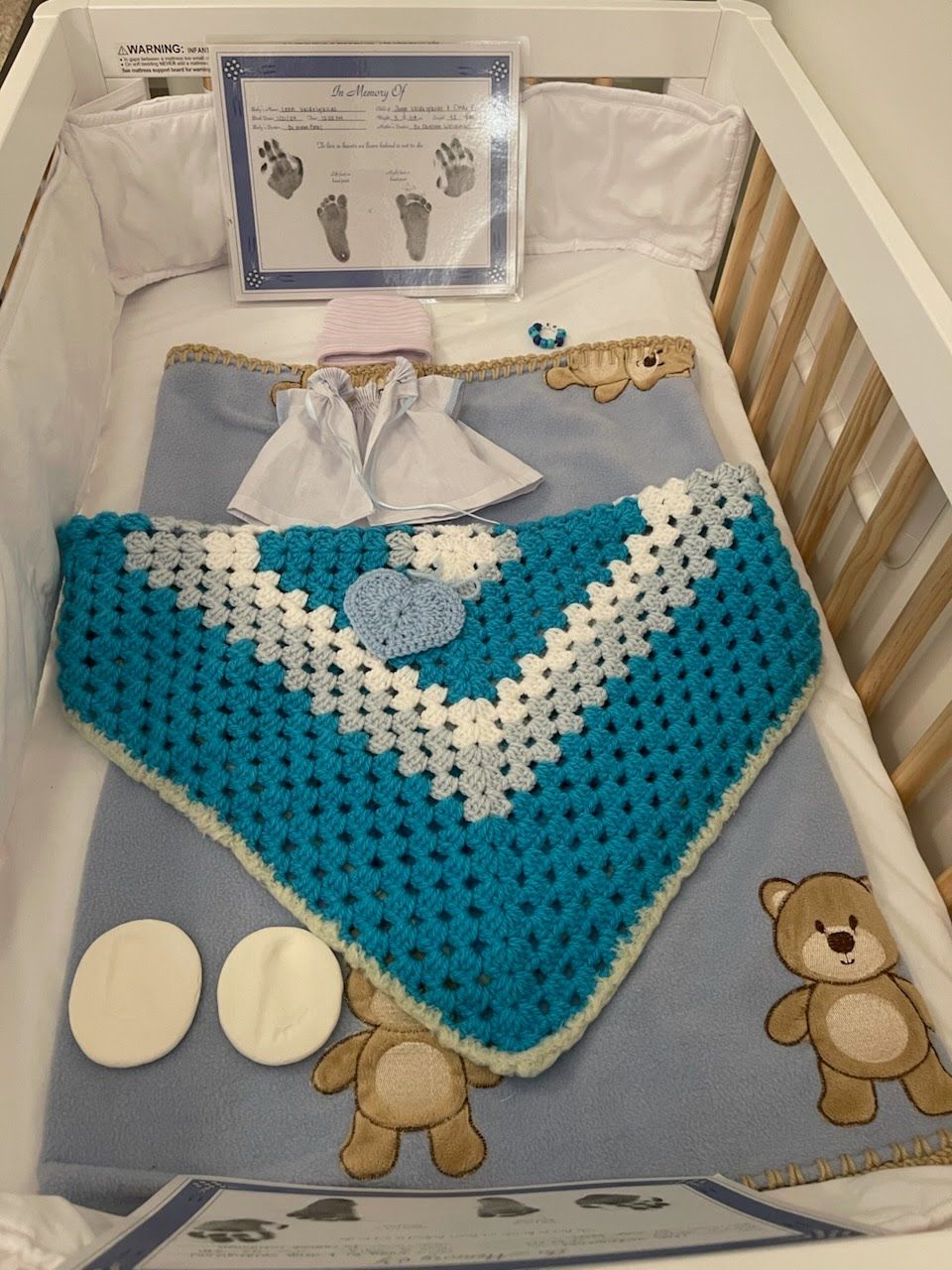 Baby Leons empty crib.